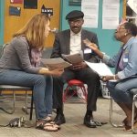 Powerful Conversations on Race session with two women and one man seated and engaged in dialogue.