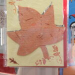 - Spirit & Place, IU Indianapolis Handmade card with a maple leaf design.