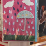 - Spirit & Place, IU Indianapolis Handmade card with umbrella, rain drops, and clouds